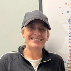 A headshot photo of Maureen, the April 2026 POM